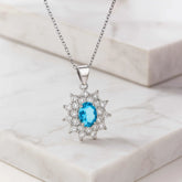 925 Sterling Silver Blue Oval Pendant Necklace | Rhodium Plated with Cubic Zirconia Halo